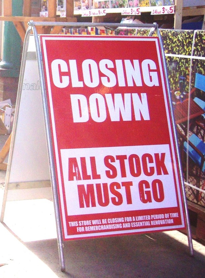 Image of a closing down sale board uotside a shop