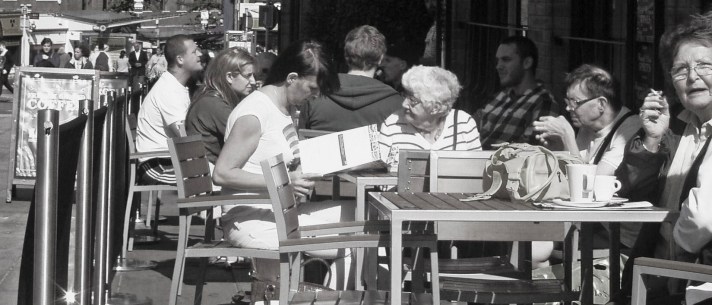 people outside a cafe
