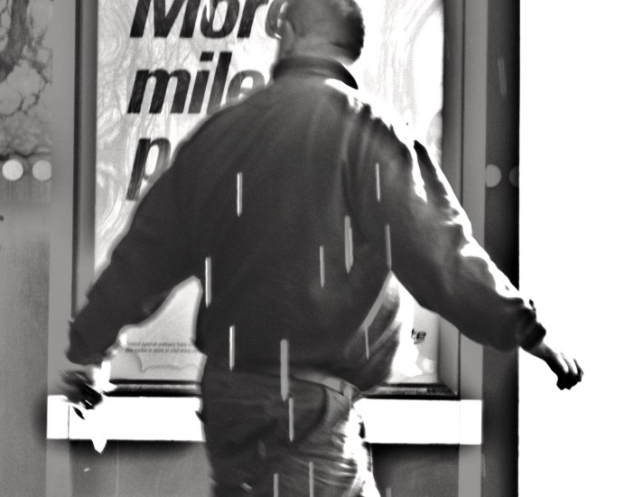 Man with arms outstretched as if in a cross