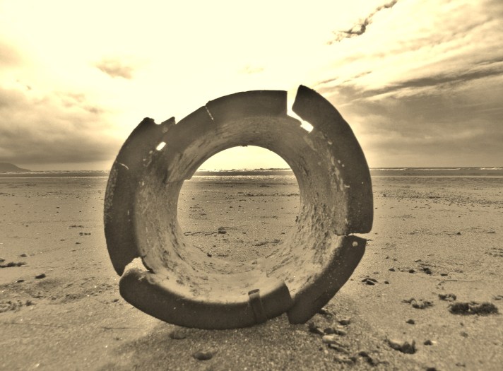 broken bucket on a beach